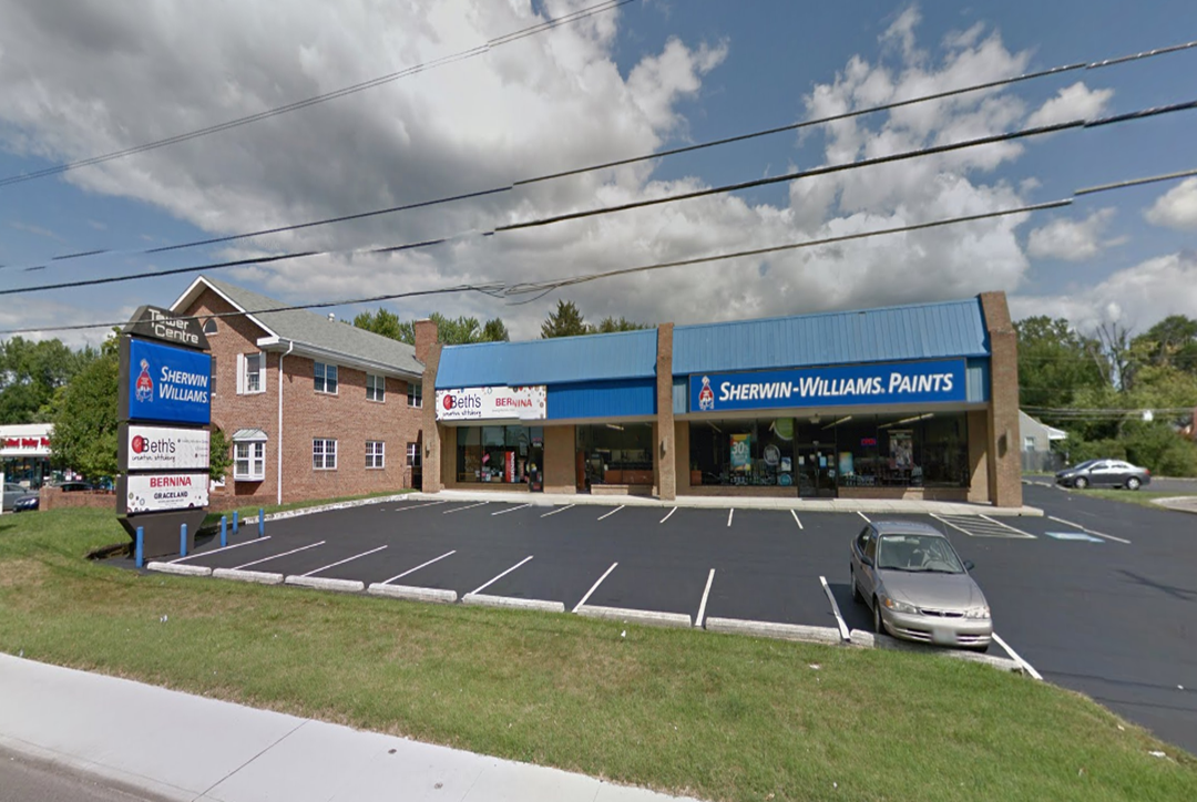 Paint retailer storefront in the two-tenant retail building